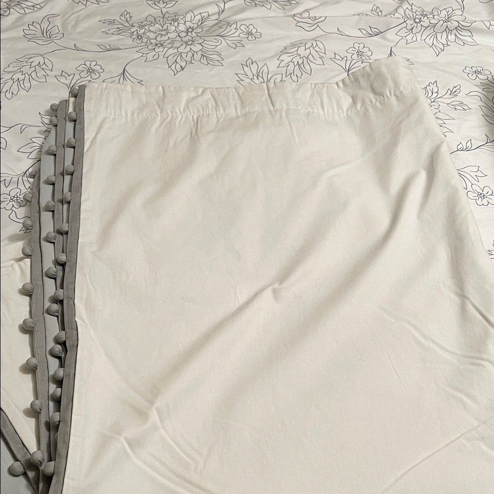 Pair of white Pottery Barn Pom-Trim Curtains